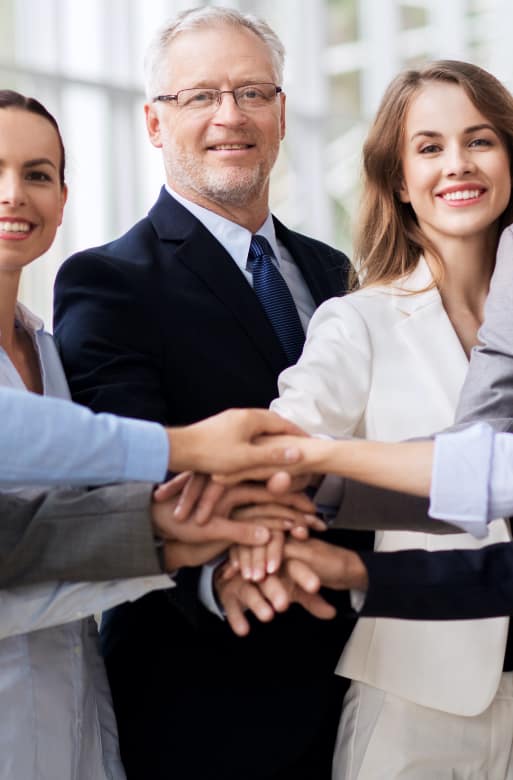 Group of employees with all hands in