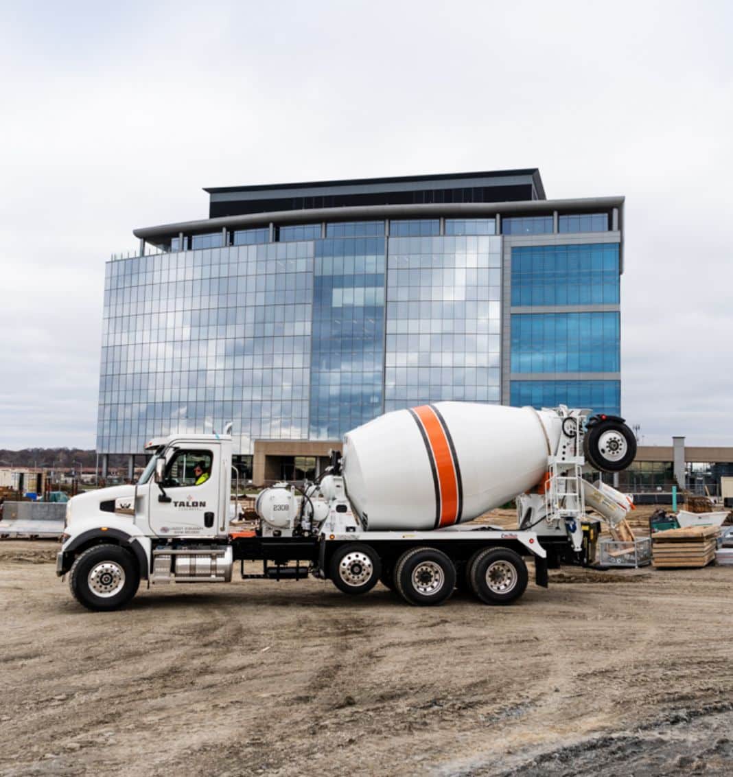 Cement truck in front of building