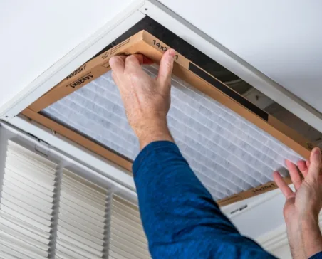 HVAC Service working in ceiling