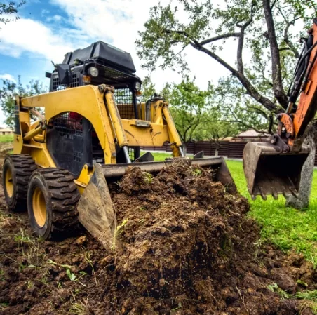Earth moving tools working in front yard
