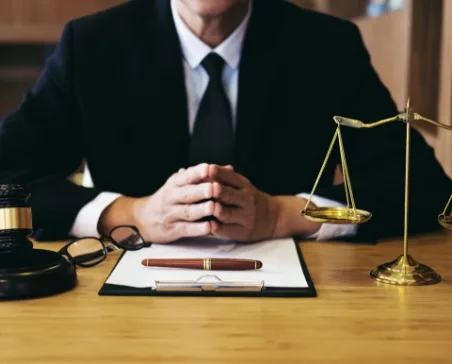 Lawyer at desk with contract
