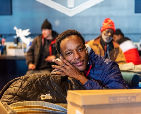 Man sitting at table with coat