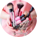 Woman holding makeup brushes