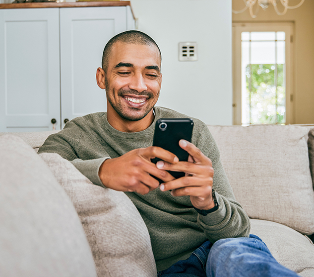 Man holding phone searching the internet