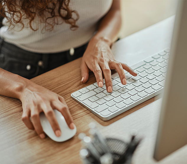 Woman siting at computer doing local business internet search